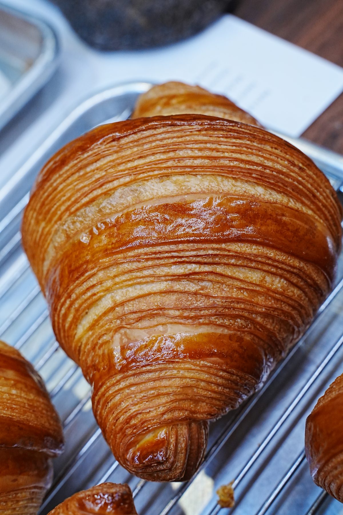 Finished croissant on a cooling rack